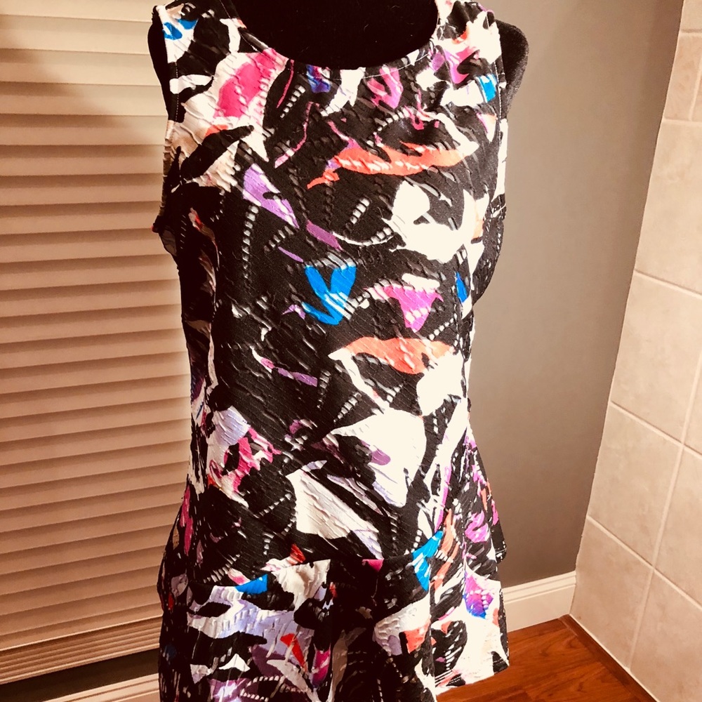 Multicolored top with asymmetrical peplum